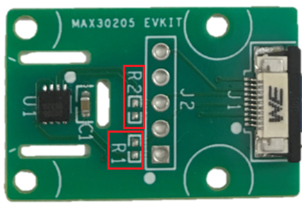 Figure 3. Highlights the location of R1 and R2 pads with red boxes on the MAX30205EVSYS.