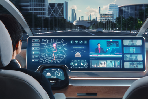 a man driving in a car with a futristic touch screen dashboard