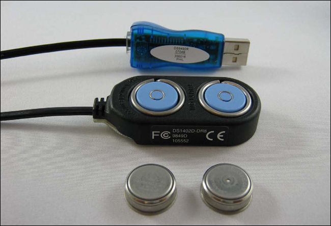 Figure 1. From front to back: logger iButtons, a Blue Dot™ receptor, a USB adapter.