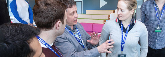 Advisor explains strategy to team members