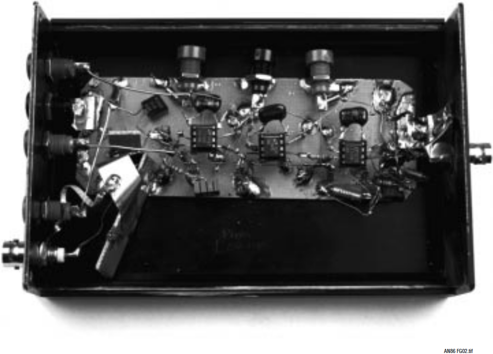 Figure G2. Settling Time Amplifier Construction. Bandwidth Is Only 10kHz, Although Gain of 2000 Necessitates Layout Care to Avoid Parasitic Feedback Induced Oscillation. Input (Photo Lower Left) Is Fully Shielded, Preventing Radiative Feedthrough to Amplifier. Enclosure Shields Circuit from Stray RF and Pickup.