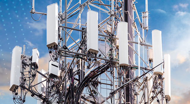 5G MIMO close-up with blue sky and clouds at the background