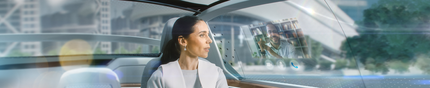 Woman sitting in autonomous vehicle chatting on a VR video conference screen overlaid on the car window.