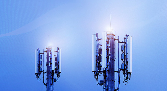 Communication towers with blue background and textured overlay