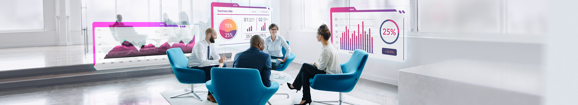 People in office building seated casually in a meeting area.