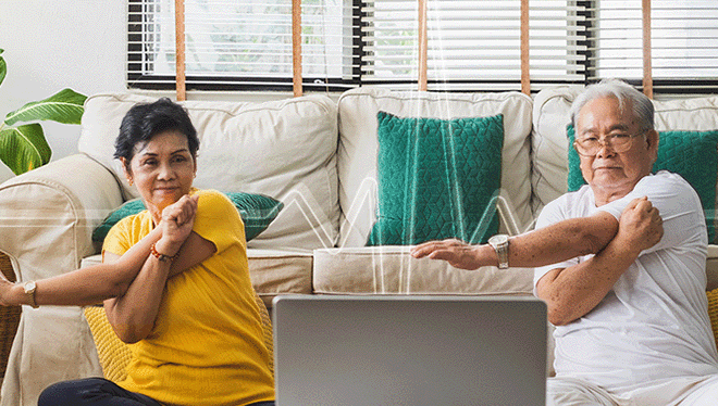 an older couple tracking their heart health while being active