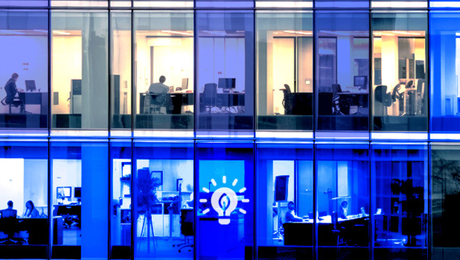 Hero image showing 2 stories of offices overlayed with green energy related icons