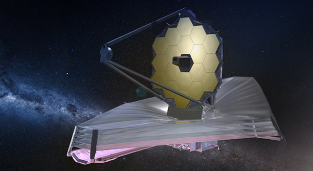 Image shows the James Webb Space Telescope in Outer Space.Behind telescope are Stars, Galaxies and bright light from a star.