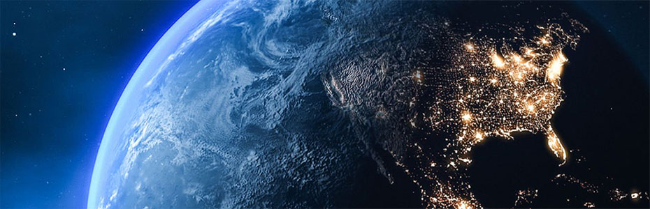 Earth divided between day and night, with cities lit by artificial lights.