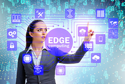 A businesswoman interacts with a futuristic digital interface displaying 'EDGE computing' at the center, surrounded by interconnected technology icons representing cloud computing, security, and data processing.